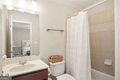 Discover timeless elegance and modern comfort in this on Woodmont Golf and Country Club in Georgia - for sale on GolfHomes.com, golf home, golf lot