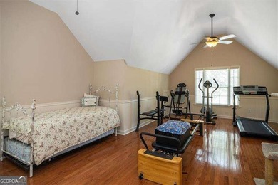 Discover timeless elegance and modern comfort in this on Woodmont Golf and Country Club in Georgia - for sale on GolfHomes.com, golf home, golf lot