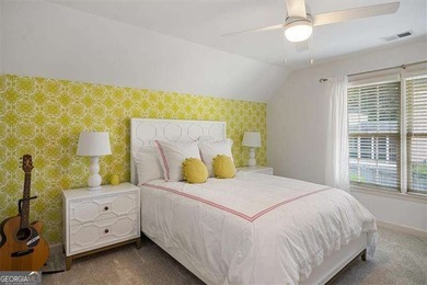 Discover timeless elegance and modern comfort in this on Woodmont Golf and Country Club in Georgia - for sale on GolfHomes.com, golf home, golf lot