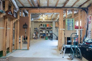 Discover timeless elegance and modern comfort in this on Woodmont Golf and Country Club in Georgia - for sale on GolfHomes.com, golf home, golf lot