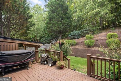 Discover timeless elegance and modern comfort in this on Woodmont Golf and Country Club in Georgia - for sale on GolfHomes.com, golf home, golf lot