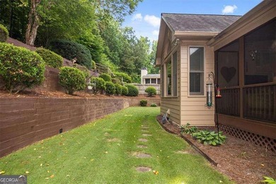 Discover timeless elegance and modern comfort in this on Woodmont Golf and Country Club in Georgia - for sale on GolfHomes.com, golf home, golf lot