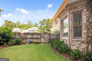 Discover timeless elegance and modern comfort in this on Woodmont Golf and Country Club in Georgia - for sale on GolfHomes.com, golf home, golf lot