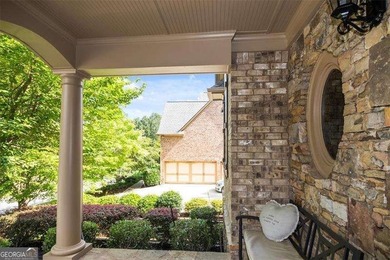 Discover timeless elegance and modern comfort in this on Woodmont Golf and Country Club in Georgia - for sale on GolfHomes.com, golf home, golf lot