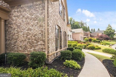 Discover timeless elegance and modern comfort in this on Woodmont Golf and Country Club in Georgia - for sale on GolfHomes.com, golf home, golf lot