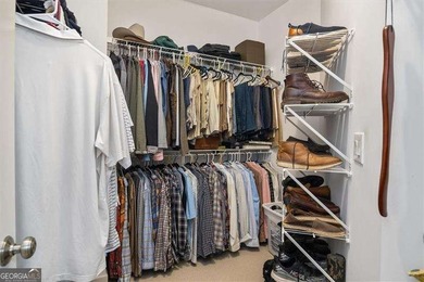 Discover timeless elegance and modern comfort in this on Woodmont Golf and Country Club in Georgia - for sale on GolfHomes.com, golf home, golf lot