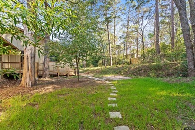 Stunning Hideaway Lake Retreat with Partial Water Views on Hide-A-Way Lake Golf Course in Texas - for sale on GolfHomes.com, golf home, golf lot