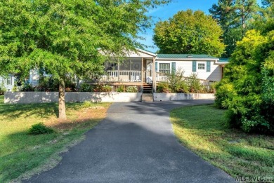 This spacious doublewide offers new  laminate flooring and on River Ridge Golf Club in Virginia - for sale on GolfHomes.com, golf home, golf lot