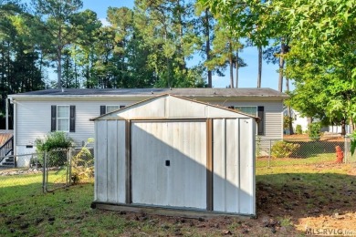 This spacious doublewide offers new  laminate flooring and on River Ridge Golf Club in Virginia - for sale on GolfHomes.com, golf home, golf lot
