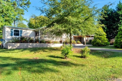 This spacious doublewide offers new  laminate flooring and on River Ridge Golf Club in Virginia - for sale on GolfHomes.com, golf home, golf lot