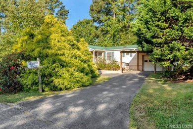 This spacious doublewide offers new  laminate flooring and on River Ridge Golf Club in Virginia - for sale on GolfHomes.com, golf home, golf lot