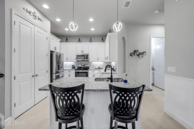 Step into refined elegance with this meticulously maintained on Plantation Bay Golf and Country Club in Florida - for sale on GolfHomes.com, golf home, golf lot