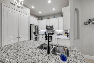 Step into refined elegance with this meticulously maintained on Plantation Bay Golf and Country Club in Florida - for sale on GolfHomes.com, golf home, golf lot
