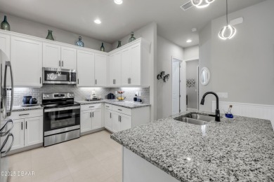 Step into refined elegance with this meticulously maintained on Plantation Bay Golf and Country Club in Florida - for sale on GolfHomes.com, golf home, golf lot