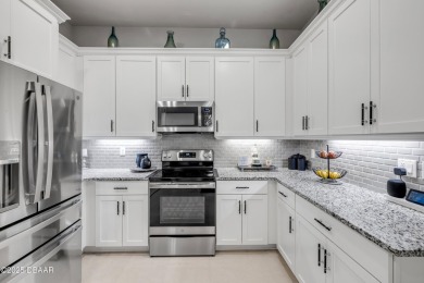 Step into refined elegance with this meticulously maintained on Plantation Bay Golf and Country Club in Florida - for sale on GolfHomes.com, golf home, golf lot