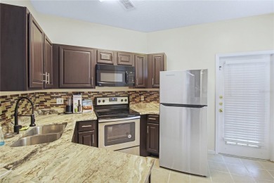 Beautifully Remodeled 3-Bedroom, 2-Bath First-Floor Condo in New on Heritage Isles Golf and Country Club in Florida - for sale on GolfHomes.com, golf home, golf lot