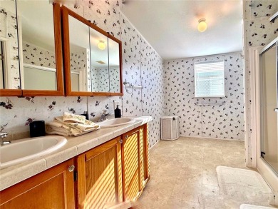 WELCOME to this spacious home in the resort-style 55+ on Apollo Beach Golf and Sea Club in Florida - for sale on GolfHomes.com, golf home, golf lot