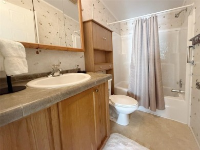 WELCOME to this spacious home in the resort-style 55+ on Apollo Beach Golf and Sea Club in Florida - for sale on GolfHomes.com, golf home, golf lot
