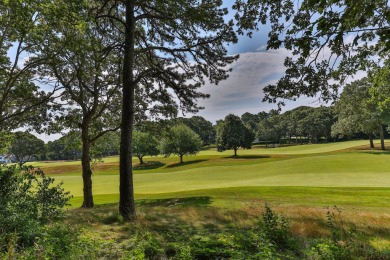 High on a hill overlooking the verdant rolling landscape of one on Oyster Harbors Club in Massachusetts - for sale on GolfHomes.com, golf home, golf lot