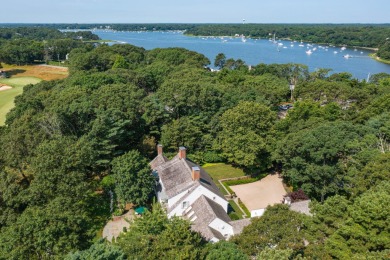 High on a hill overlooking the verdant rolling landscape of one on Oyster Harbors Club in Massachusetts - for sale on GolfHomes.com, golf home, golf lot