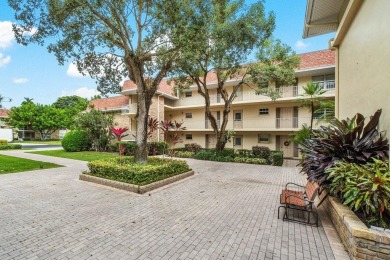 Wonderful First Floor 2 bedroom 2 bath end unit condo with on BallenIsles Golf and Country Club in Florida - for sale on GolfHomes.com, golf home, golf lot