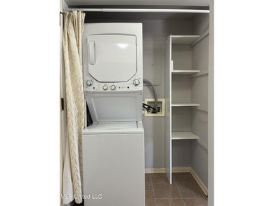 Two bedroom condo on the golf course with a deck and great views on Diamondhead Country Club in Mississippi - for sale on GolfHomes.com, golf home, golf lot