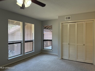 Two bedroom condo on the golf course with a deck and great views on Diamondhead Country Club in Mississippi - for sale on GolfHomes.com, golf home, golf lot