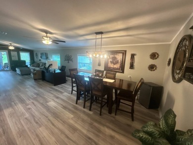 This completely remodeled, stucco Palm Harbor home is located on on Del Tura Golf and Country Club in Florida - for sale on GolfHomes.com, golf home, golf lot