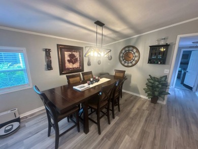 This completely remodeled, stucco Palm Harbor home is located on on Del Tura Golf and Country Club in Florida - for sale on GolfHomes.com, golf home, golf lot