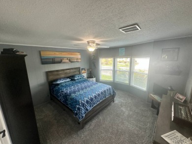 This completely remodeled, stucco Palm Harbor home is located on on Del Tura Golf and Country Club in Florida - for sale on GolfHomes.com, golf home, golf lot