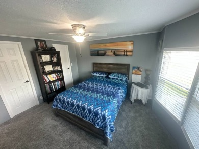 This completely remodeled, stucco Palm Harbor home is located on on Del Tura Golf and Country Club in Florida - for sale on GolfHomes.com, golf home, golf lot
