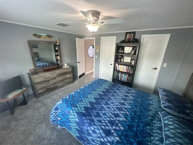 This completely remodeled, stucco Palm Harbor home is located on on Del Tura Golf and Country Club in Florida - for sale on GolfHomes.com, golf home, golf lot