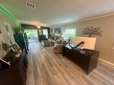 This completely remodeled, stucco Palm Harbor home is located on on Del Tura Golf and Country Club in Florida - for sale on GolfHomes.com, golf home, golf lot