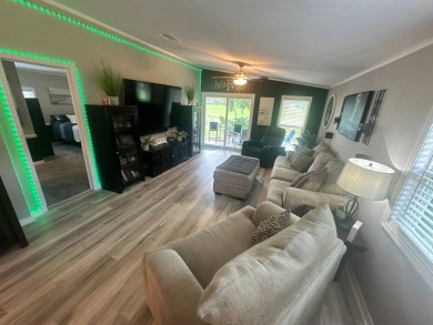 This completely remodeled, stucco Palm Harbor home is located on on Del Tura Golf and Country Club in Florida - for sale on GolfHomes.com, golf home, golf lot