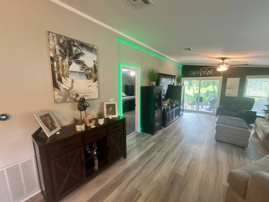 This completely remodeled, stucco Palm Harbor home is located on on Del Tura Golf and Country Club in Florida - for sale on GolfHomes.com, golf home, golf lot