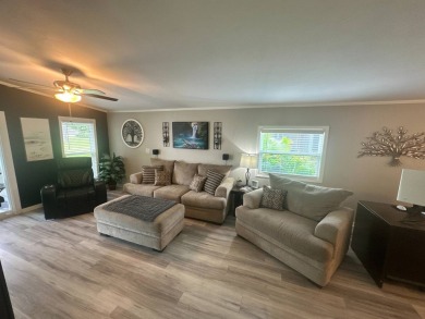This completely remodeled, stucco Palm Harbor home is located on on Del Tura Golf and Country Club in Florida - for sale on GolfHomes.com, golf home, golf lot