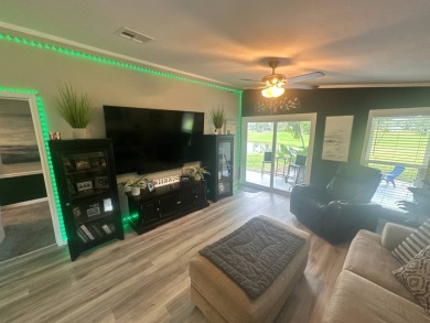 This completely remodeled, stucco Palm Harbor home is located on on Del Tura Golf and Country Club in Florida - for sale on GolfHomes.com, golf home, golf lot