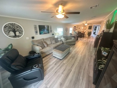 This completely remodeled, stucco Palm Harbor home is located on on Del Tura Golf and Country Club in Florida - for sale on GolfHomes.com, golf home, golf lot