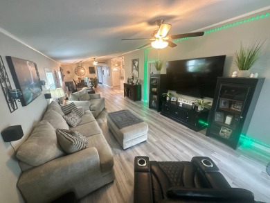 This completely remodeled, stucco Palm Harbor home is located on on Del Tura Golf and Country Club in Florida - for sale on GolfHomes.com, golf home, golf lot