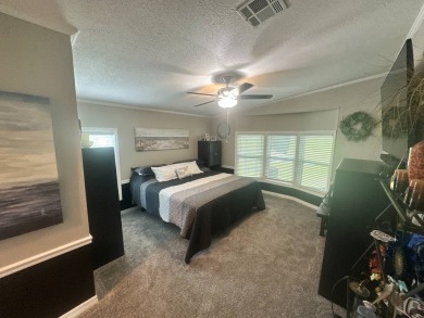 This completely remodeled, stucco Palm Harbor home is located on on Del Tura Golf and Country Club in Florida - for sale on GolfHomes.com, golf home, golf lot