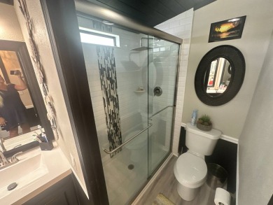 This completely remodeled, stucco Palm Harbor home is located on on Del Tura Golf and Country Club in Florida - for sale on GolfHomes.com, golf home, golf lot