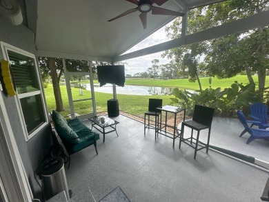 This completely remodeled, stucco Palm Harbor home is located on on Del Tura Golf and Country Club in Florida - for sale on GolfHomes.com, golf home, golf lot