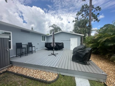 This completely remodeled, stucco Palm Harbor home is located on on Del Tura Golf and Country Club in Florida - for sale on GolfHomes.com, golf home, golf lot