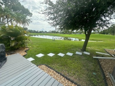 This completely remodeled, stucco Palm Harbor home is located on on Del Tura Golf and Country Club in Florida - for sale on GolfHomes.com, golf home, golf lot