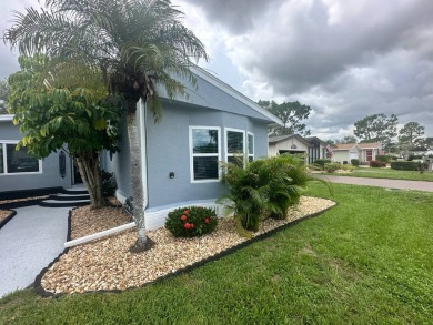 This completely remodeled, stucco Palm Harbor home is located on on Del Tura Golf and Country Club in Florida - for sale on GolfHomes.com, golf home, golf lot