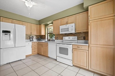 Experience tranquil waterfront living with elevated views in the on Jonathans Landing Golf Club in Florida - for sale on GolfHomes.com, golf home, golf lot