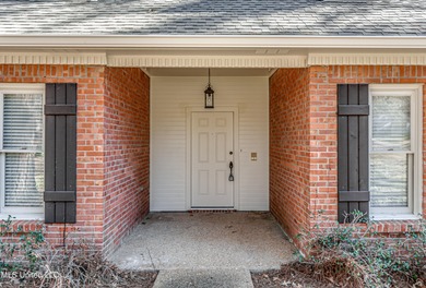 Discover this beautifully updated 3-bedroom, 2-bathroom home on Castlewoods Golf Club in Mississippi - for sale on GolfHomes.com, golf home, golf lot