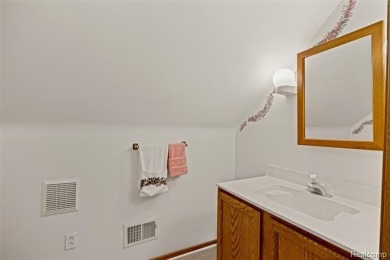 Expansive 2,184 sq. ft. home with a 1,456 sq. ft. basement and on West Shore Golf and Country Club in Michigan - for sale on GolfHomes.com, golf home, golf lot
