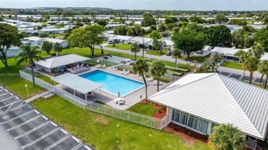 Make this bright and peaceful 2/2 CORNER UNIT, IMPACT WINDOWS on Leisureville Community Association in Florida - for sale on GolfHomes.com, golf home, golf lot