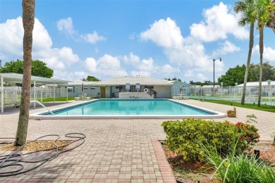 Make this bright and peaceful 2/2 CORNER UNIT, IMPACT WINDOWS on Leisureville Community Association in Florida - for sale on GolfHomes.com, golf home, golf lot